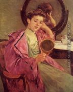 Woman At Her Toilette - Mary Cassatt
